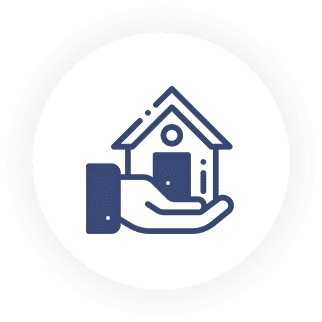 A hand holding a house with a cell phone in it.