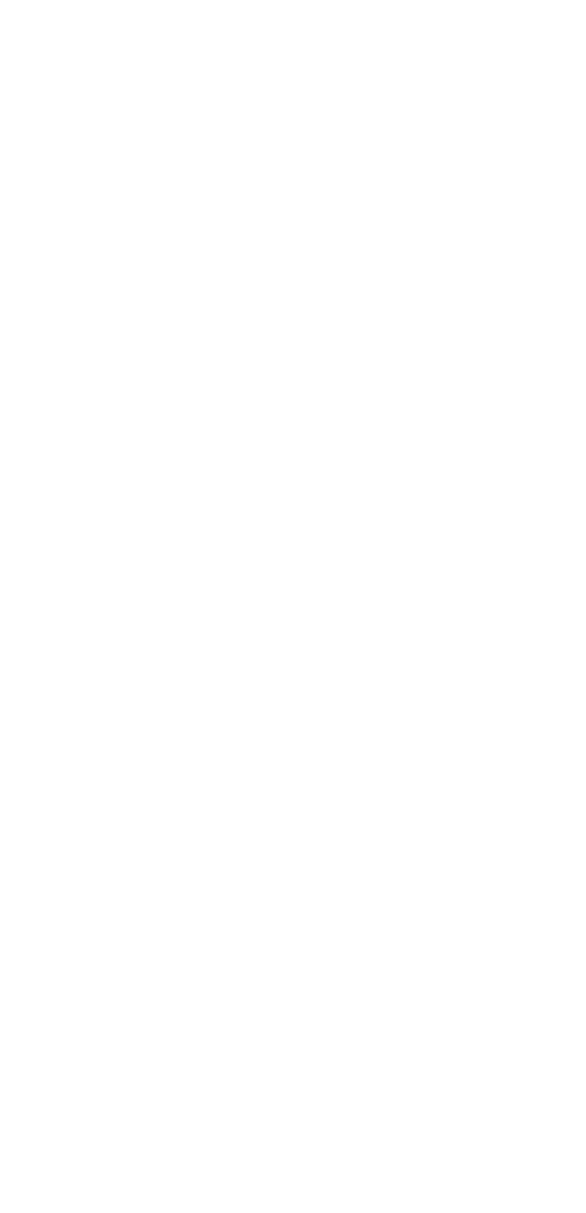 A candle is lit in the dark.